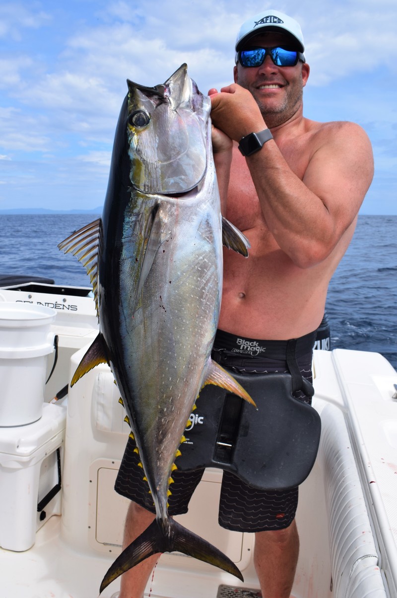 Angler holding yellowfin tuna