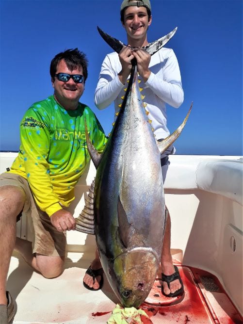 2 angler posing with yellowfin tuna