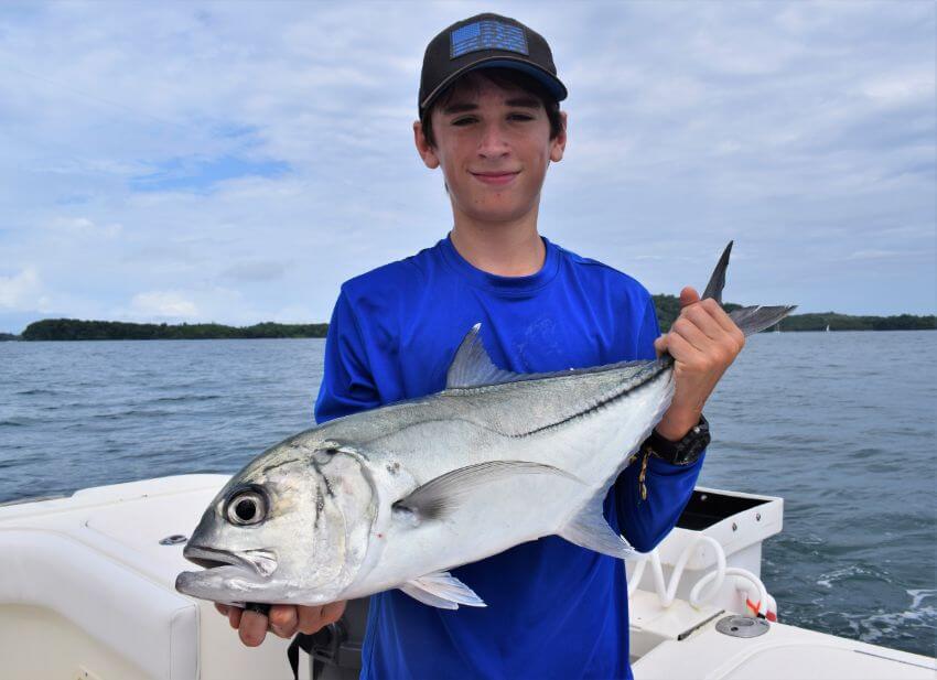 Junior angler posing with Jack Crevalle