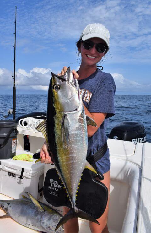 Member of the Warner clan posing with yellowfin tuna