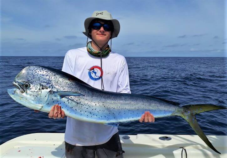 Angler posing with Dorado, also known as ‘Mahi-Mahi’ or ‘Dolphin’