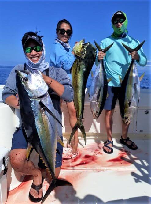 Anglers posing with yellowfin tunas and Dorado, also known as ‘Mahi-Mahi’ or ‘Dolphin’