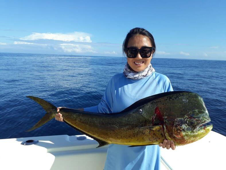 Female angler posing with Dorado, also known as ‘Mahi-Mahi’ or ‘Dolphin’