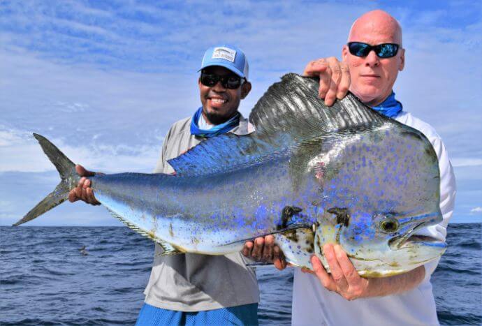 Mate and angler posing with Dorado, also known as ‘Mahi-Mahi’ or ‘Dolphin’