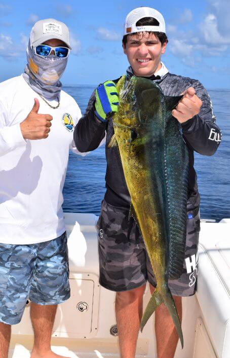 angler posing with Dorado, also known as ‘Mahi-Mahi’ or ‘Dolphin’