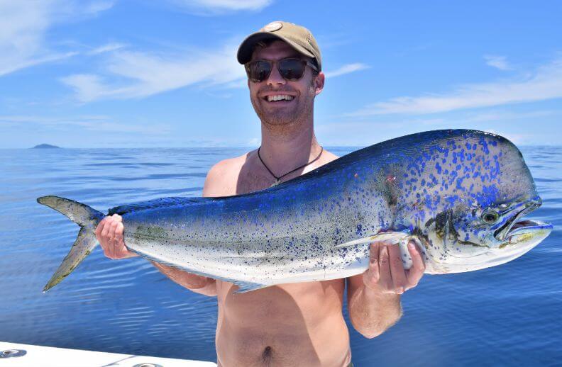 angler posing with Dorado, also known as ‘Mahi-Mahi’ or ‘Dolphin’