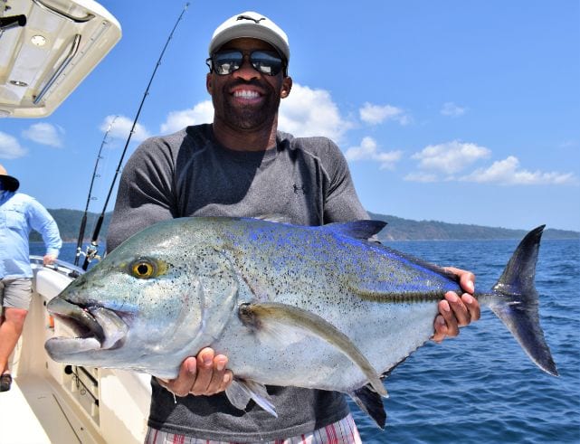 Angler posing for picture holding Bluefin Trevalle
