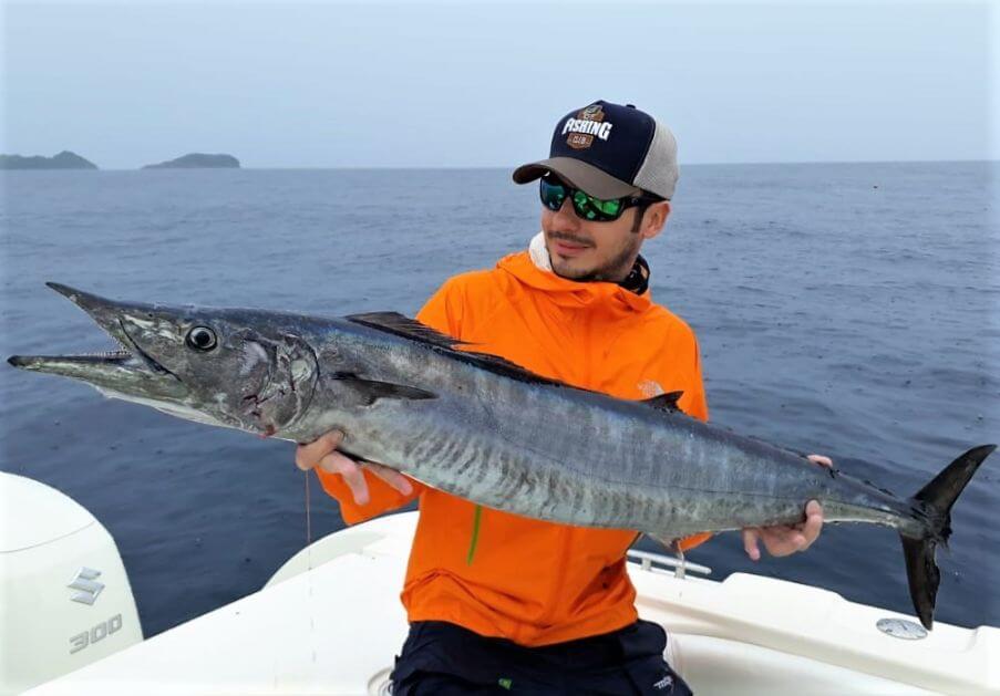 angler posing with wahoo