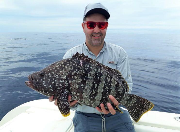 Angler posing with Leather bass at Sport Fish Panama Island Lodge
