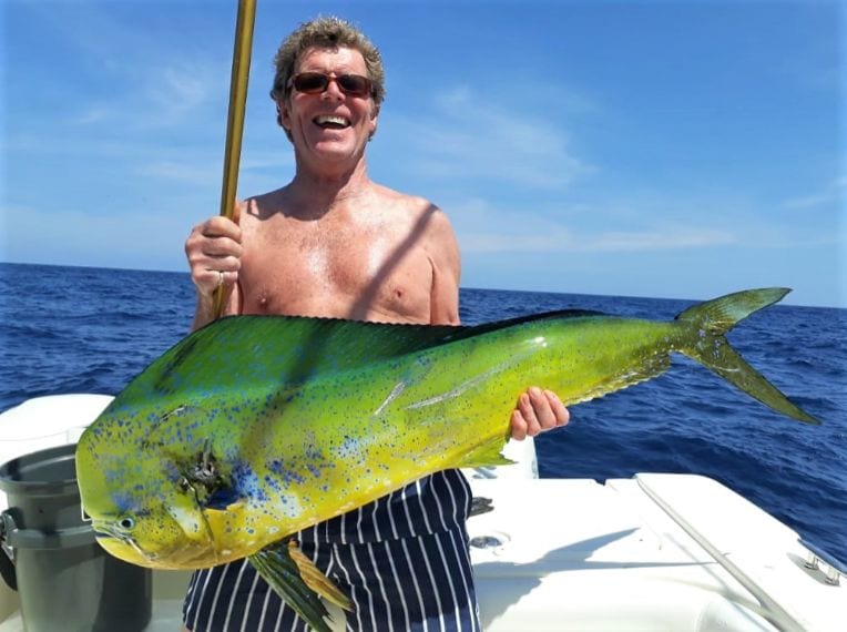 Angler posing for picture holding Mahi-mahi