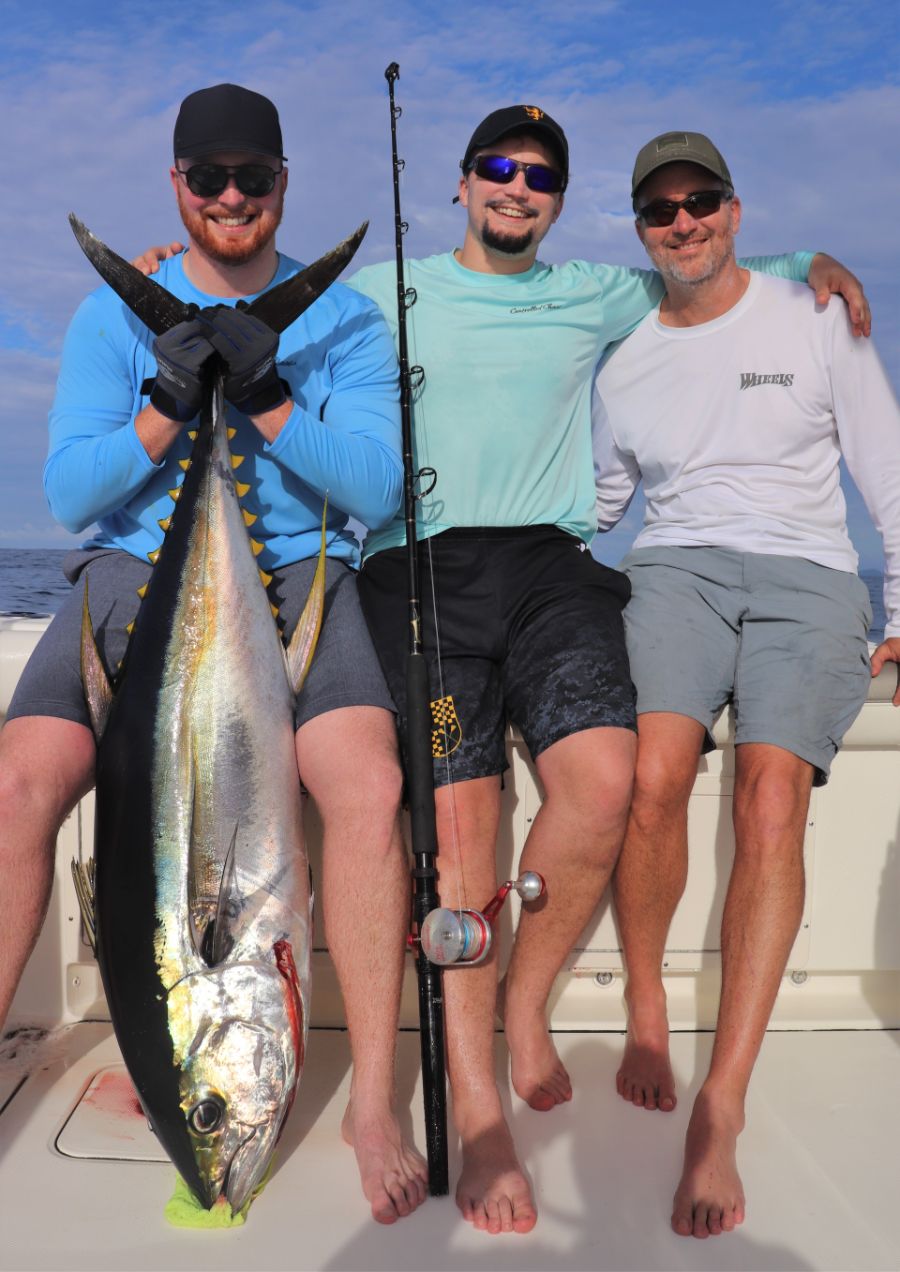 3 anglers posing with yellofina tuna