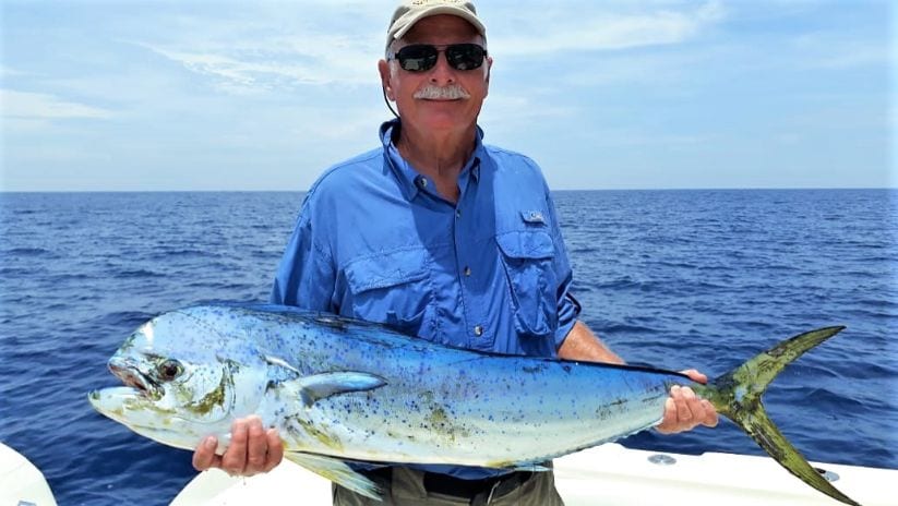 Angler posing with dorado, also known as ‘Mahi-Mahi’ or ‘Dolphin’
