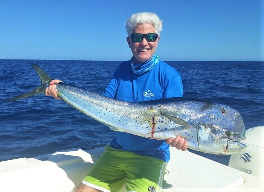 Angler posing with bull dorado Also known as ‘Mahi-Mahi’ or ‘Dolphin’ 